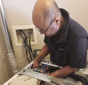 edmonton dryer repair - naz repairing a dryer