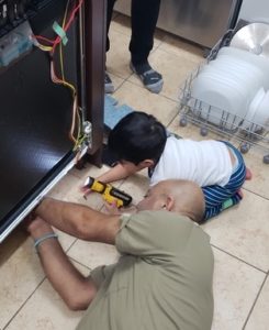 fridge repair edmonton - naz repairing a refrigerator 